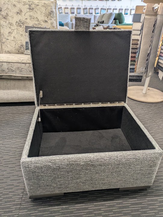 A real Archer’s upholstered storage box with its lid open