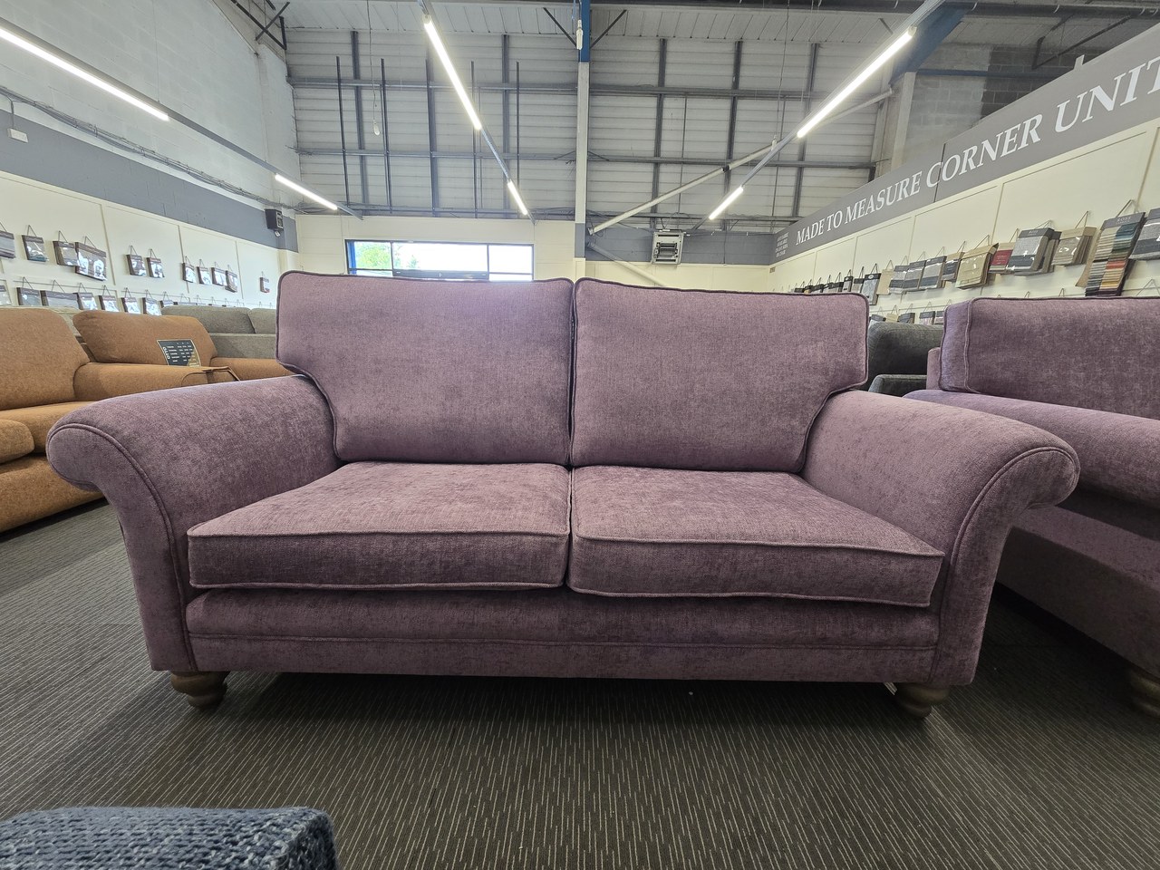 Mauve Mortimer capped-arm sofa with two back cushions, two seat cushions and broad curved arms.