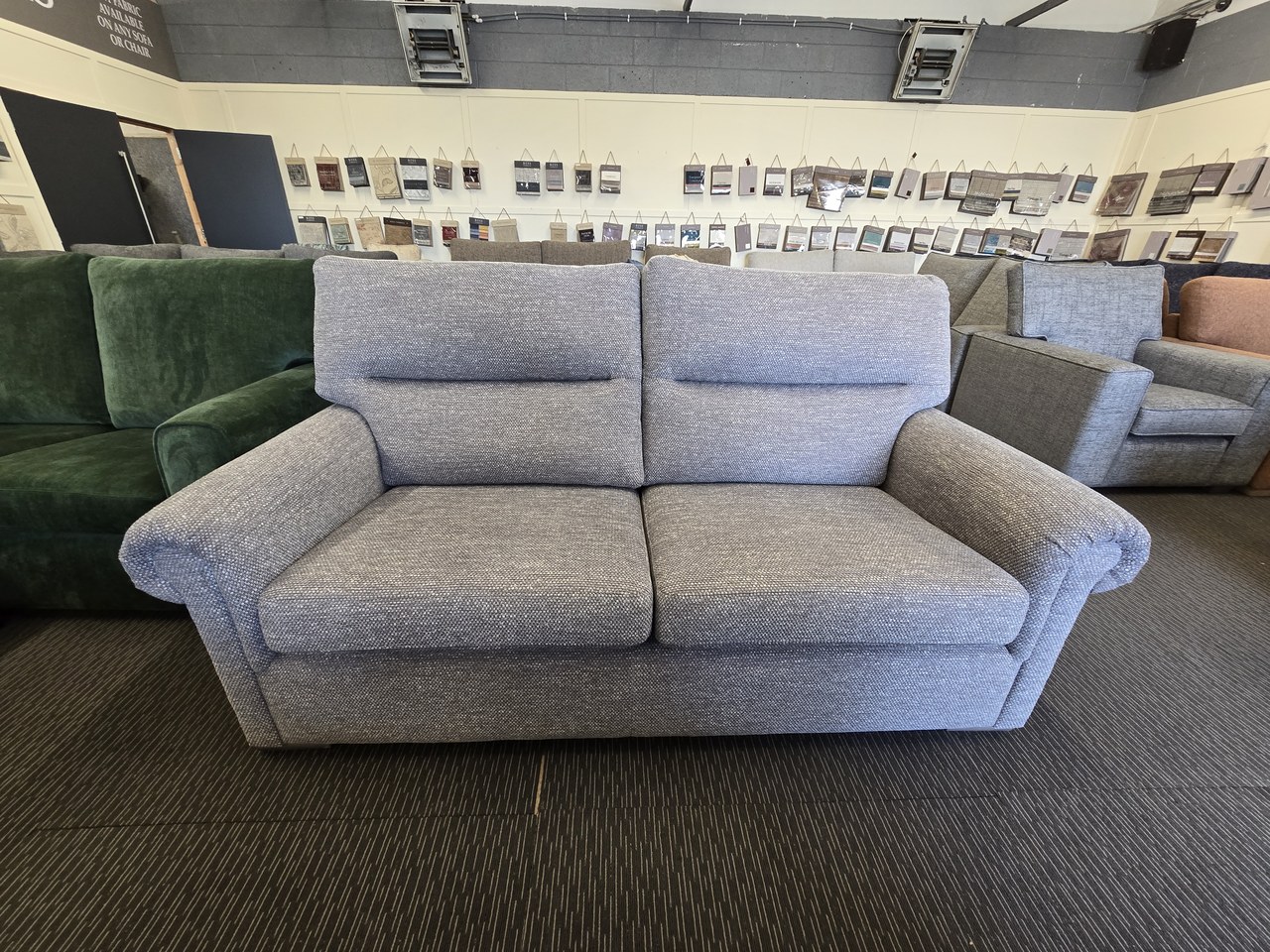 Light grey Wade sofa with two segmented back cushions, two seat cushions and rounded arms.