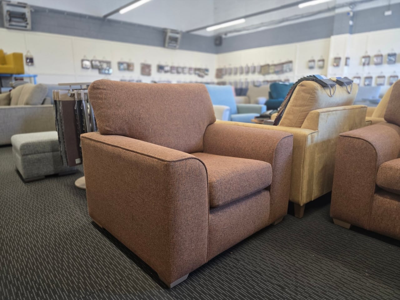 Three-quarter view of the matching orange Otto chair
