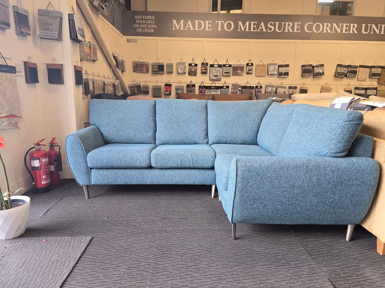 Alternate view of the blue teal Clifton corner sofa and visible feet