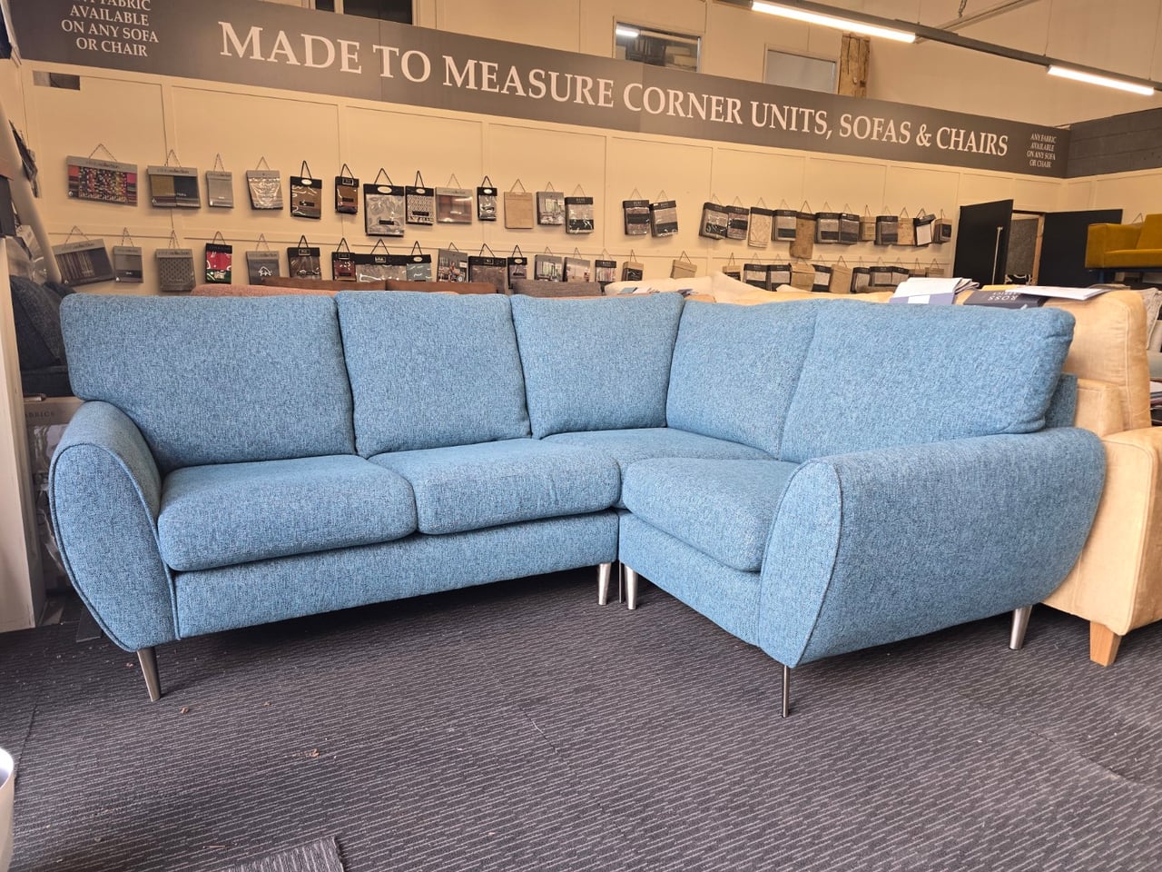 Blue teal Clifton corner sofa showing its full arrangement and rounded arms