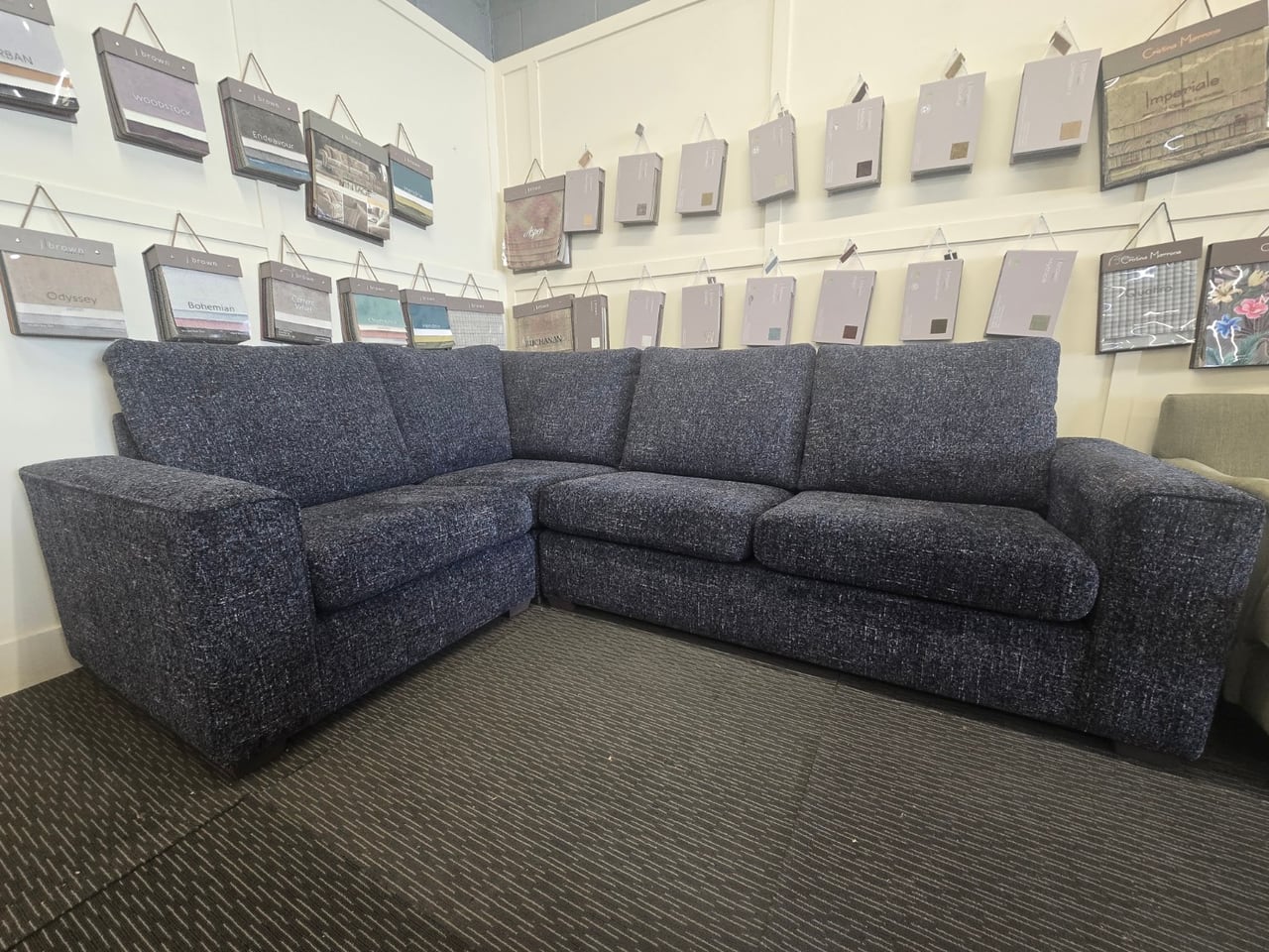 Dark blue Inca corner sofa showing both runs and broad squared arms